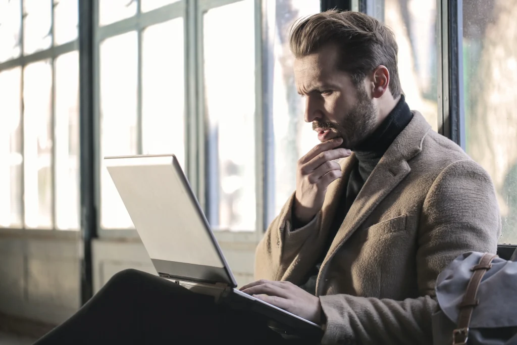 Man in front of computer doing IT assessment
