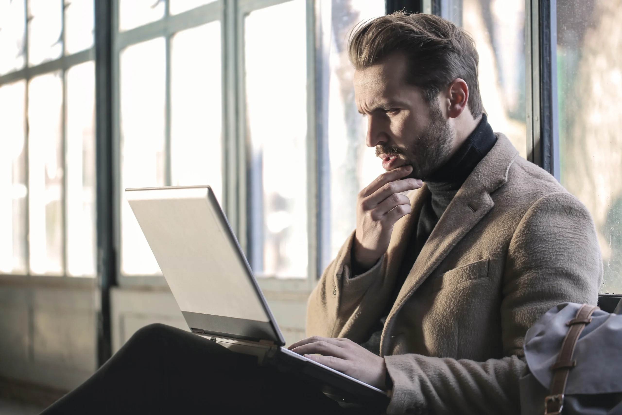 Man in front of computer doing IT assessment