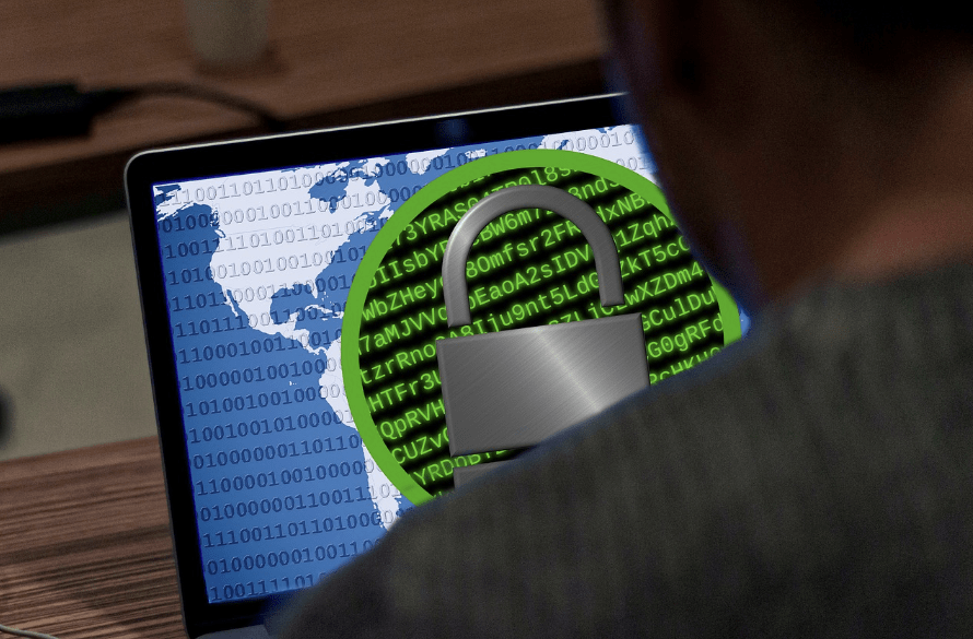 over the shoulder look at a laptop screen with a lock.