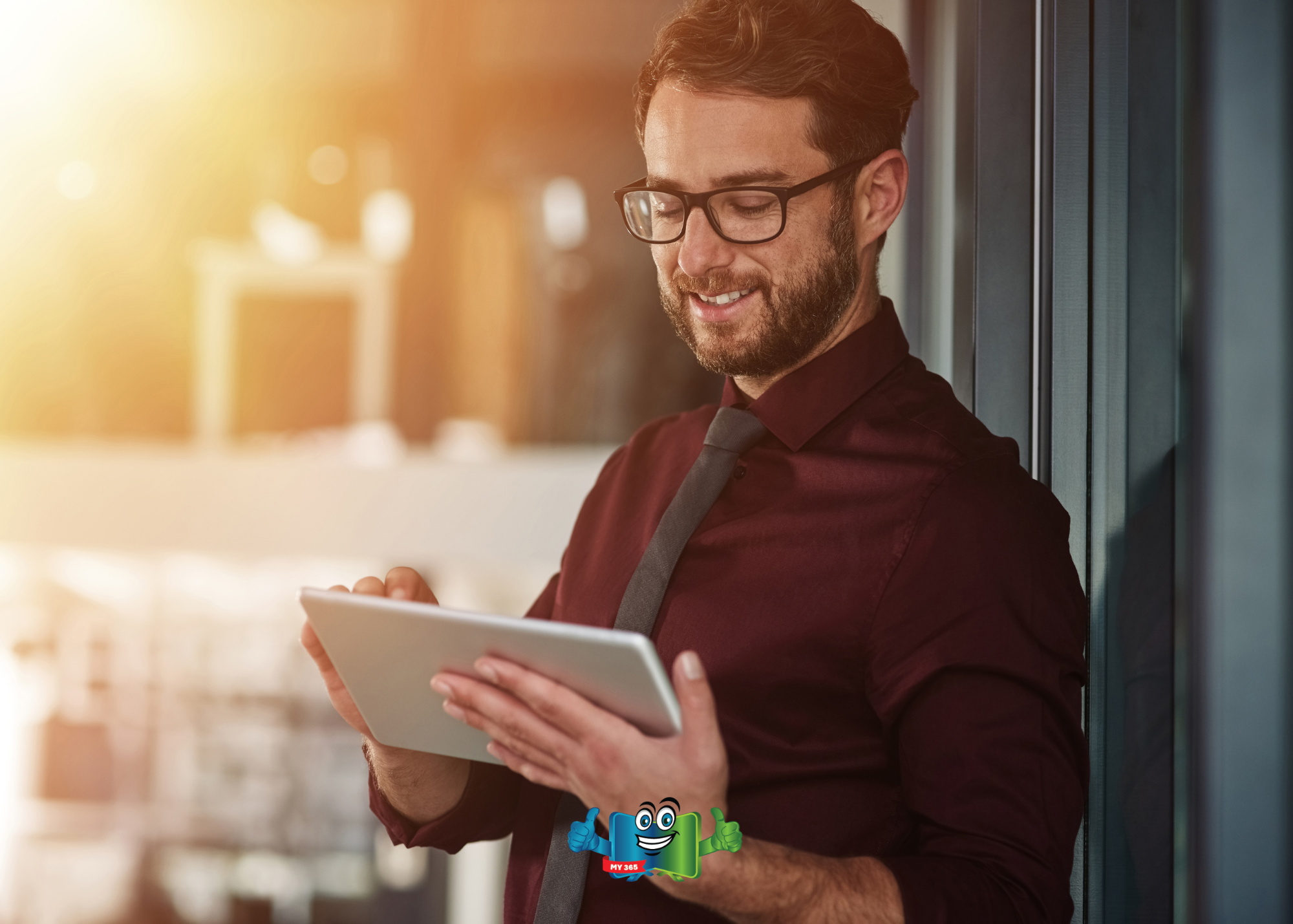 Two coworkers reviewing information on a computer screen in an office.
