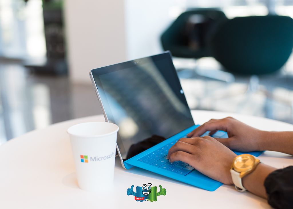 Person using a tablet with a keyboard while working at a table.